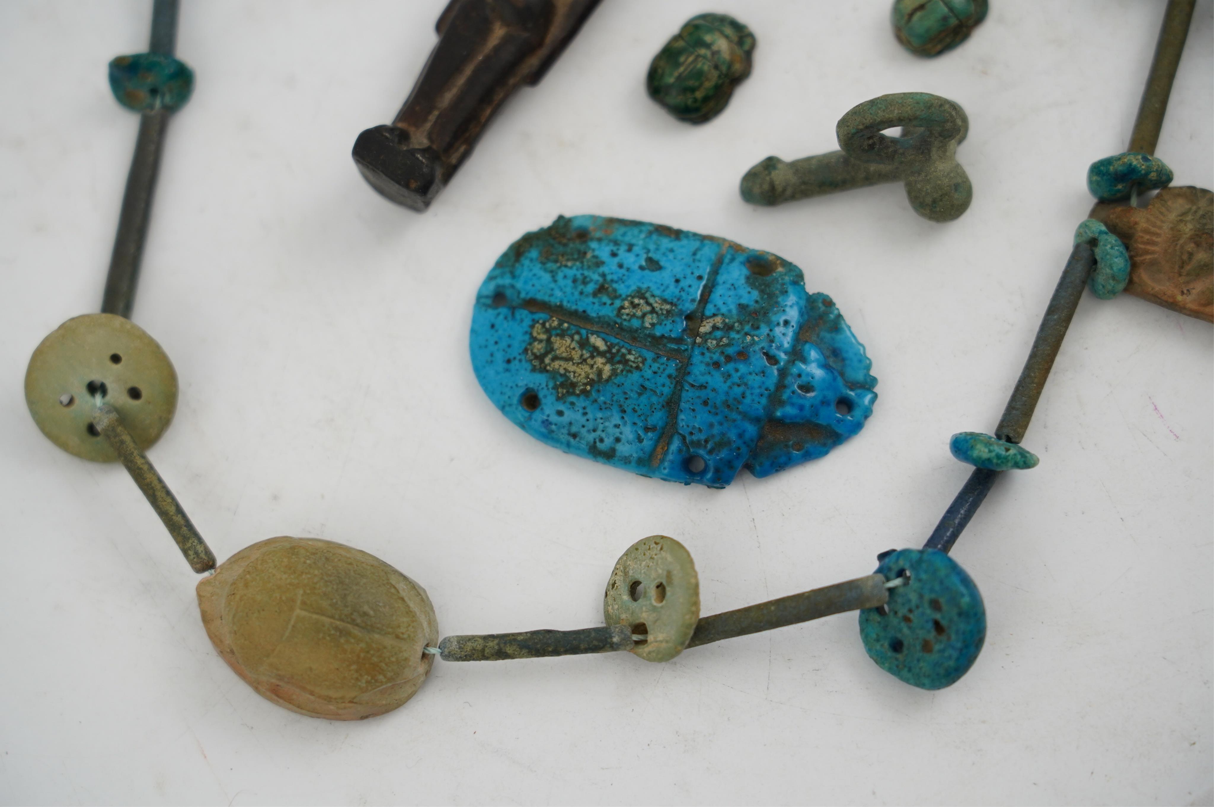 An ancient Egyptian faience necklace, amulets and scarabs, late Kingdom to Ptolemaic period